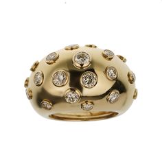 The Christian Dior Vintage Bombe Diamond 18k Yellow Gold Cocktail Ring is an exquisite piece that exemplifies the elegance and luxury synonymous with the Dior brand. This stunning cocktail ring is a perfect blend of classic design and sophisticated glamour, making it a must-have for any jewelry connoisseur. Crafted from 18k yellow gold, this ring features a bold and distinctive bombe design. The bombe style, characterized by its rounded, dome-like shape, creates a striking silhouette that is both eye-catching and timeless. The warm, rich hue of the yellow gold adds a touch of opulence, enhancing the overall allure of the piece. The surface of the ring is adorned with numerous bezel-set diamonds, each meticulously chosen for its brilliance and clarity. These diamonds are strategically place Luxury Oval Dome Ring With Pave Setting, Luxury Dome Ring With Diamond Cut For Formal Occasion, Luxury Dome Ring With Diamond Cut For Formal Events, Luxury Formal Dome Ring With Diamond Cut, Elegant Diamond Dome Ring With Diamond Cut, Elegant Diamond White Dome Ring With Diamond Cut, Luxury Diamond Cut Ring For Evening, Luxury Diamond Cut Diamond Ring For Evening, Luxury Evening Rings With Brilliant Cut