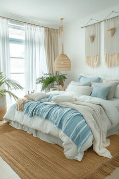 a bed with blue and white comforters in a bedroom