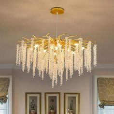 a chandelier hanging from the ceiling in a living room