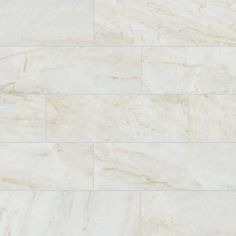 a white marble tile wall that looks like it has been polished