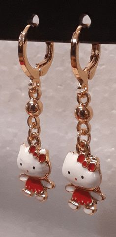 A different color and a shiny contrast, this red and white pair of small kitty's is a cute sight. Great for a casual walk or just going to the mall, this set will have you covered. Details Laminated gold Small red Kitty Red Enamel Trendy Earrings, Trendy Red Enamel Earrings, Cute Red Enamel Earrings, White Cat Design Earrings, Cat Earrings, Just Go, Different Colors, Red And White, Kitty