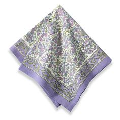 an image of a purple and green paisley pattern handkerchiefs on a white tablecloth