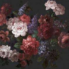 an arrangement of flowers on a black background