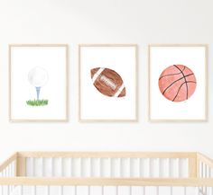 three framed sports pictures in a baby's room with a crib next to it