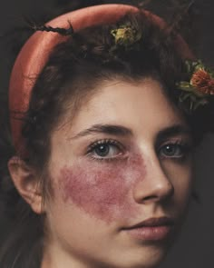 a young woman with freckles on her face