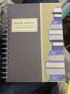 a person holding a book in their hand with the title'book notes a teacher's journal'written on it