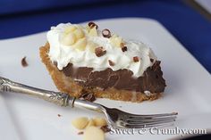 a piece of chocolate pie on a plate with a fork