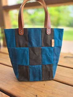 These beautiful handmade bags are made from waxed canvas sewn into fun patchwork deisgns. Each bag is a unique one-of-a-kind combination, picked and hand-sewn by me!  They can be used for your knitting, crochet, embroidery, or any projects, carry your books, or even use it as a purse. They are designed to stand up so you can work directly from them.  Each bag is handmade with beautiful, high-quality waxed canvas fabric on the exterior, a heavy canvas lining, and sturdy leather handles.  Size: ap Canvas Patchwork Shoulder Bag For Daily Use, Rectangular Cotton Shoulder Bag With Waxed Finish, Rectangular Cotton Bag With Waxed Finish, Rectangular Cotton Bags With Waxed Finish, Canvas Patchwork Shoulder Bag For Everyday, Everyday Canvas Patchwork Shoulder Bag, Canvas Patchwork Bags For Everyday Use, Patchwork Canvas Shoulder Bag For Travel, Everyday Canvas Patchwork Bags