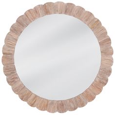 a round mirror that is made out of wood