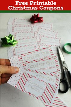 printable coupons for christmas with scissors and ribbon on the table next to them