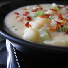 a close up of a bowl of food on a stove