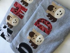 two baby blankets with monkey faces on them