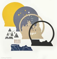 a paper cut out of a castle with a magnifying glass in front of it