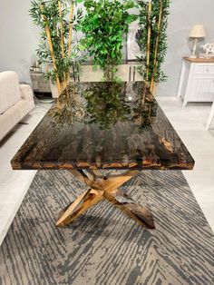 a wooden table sitting on top of a rug