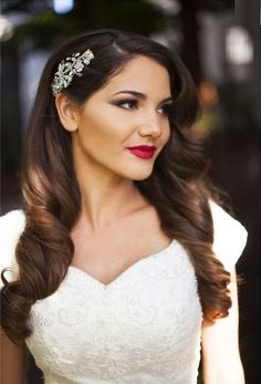 a woman with long hair wearing a wedding dress