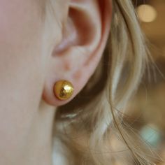 Stud earrings in 24K gold. 0.35 inches. Modern Yellow Gold Earrings With Gold-tone Hardware, Modern Yellow Gold Single Stud Earring, Gold-tone Polished 14k Gold Earrings, Luxury Yellow Gold Screw Back Earrings, 14k Yellow Gold Screw Back Earrings, Gold Studs, Gold Earrings Studs, Stud Earrings, Gold