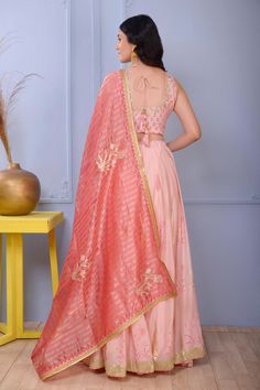 Pink cotton silk lehenga with pink foil print and gota finish. Paired with cotton silk hand embroidered blouse with lace finish and banarasi golden strip chanderi dupatta.
Component: 3
Pattern: Print and Embroidery
Type Of Work: Foil Print and Gota
Neckline: Scoop
Sleeve Type: Sleeveless
Fabric: Blouse and Lehenga: Cotton Silk; Dupatta: Banarasi Golden Stripe
Color: Pink
Other Details: 
Foil print
Lace finishing on blouse
Occasion: Sangeet - Aza Fashions Diwali Sleeveless Set With Sheer Dupatta, Sleeveless Sets With Sheer Dupatta For Festivals, Silk Sleeveless Choli With Pallu, Sleeveless Silk Choli With Pallu, Sleeveless Traditional Wear With Dupatta For Wedding, Sleeveless Traditional Wedding Wear With Dupatta, Silk Traditional Wear With Pallu, Chanderi Sleeveless Sets With Dupatta, Sleeveless Georgette Sets With Dupatta