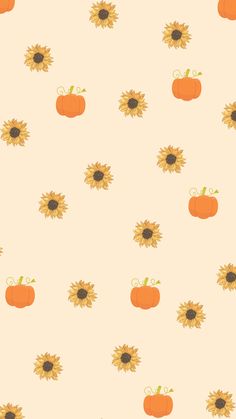 an orange pumpkin and sunflower pattern on a white background