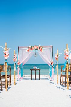 an outdoor wedding setup on the beach