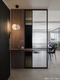 an open living room and dining area with sliding glass doors