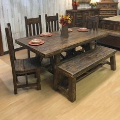 a wooden table and bench in a room