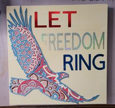 a sign with an eagle painted on it that says let freedom ring in red, white and blue