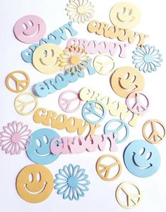 a pile of cut out letters and smiley faces