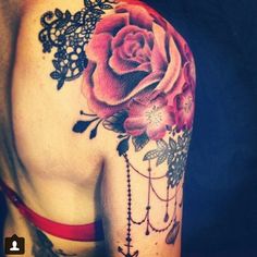 an image of a woman's arm with flowers on it and the words flower shoulder tattoos