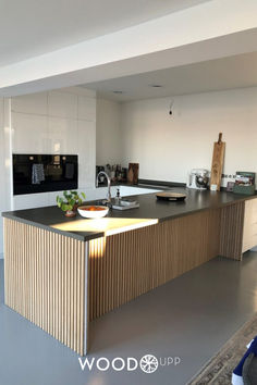 a modern kitchen with an island counter top