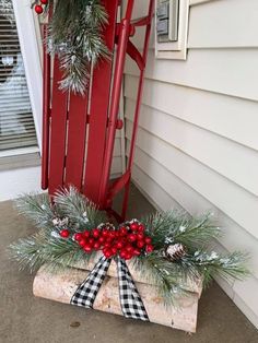 a red rocking chair with christmas decorations on it and the caption below that reads,