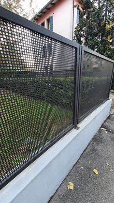 a black metal fence on the side of a building