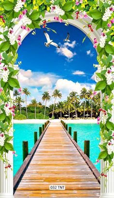 an image of a dock with flowers and birds on it's sides in front of the ocean