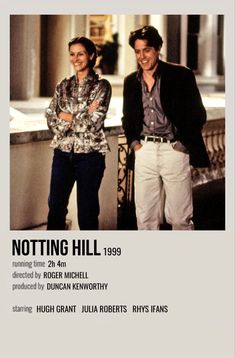 two people standing next to each other in front of a poster with the words notting hill on it