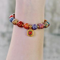 Embrace the elegance and cultural heritage with this stunning handcrafted 12mm colorful lacquer bead bracelet. 🌟 The vibrant lacquer beads are carefully polished through complex traditional techniques, paired with an 18k gold-plated charm to elevate your style and bring a touch of luxury. Perfect for daily wear or as a collectible, this bracelet blends ancient craftsmanship with modern design. 💎 Handcrafted with Natural Lacquer: Each bead is meticulously crafted using natural lacquer, enhanced Bracelets Fall, Word Bracelets, Jewelry Halloween, Halloween Bracelet, Word Bracelet, Gold Powder, Fall Jewelry, Cultural Heritage, Traditional Techniques