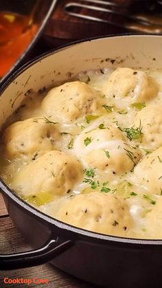 a pot filled with dumplings covered in cheese