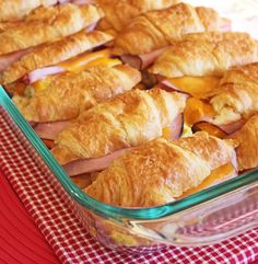 a close up of bread with ham on it and the words make ahead breakfast sandwiches