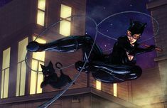 a catwoman flying through the air next to a black cat in front of a building