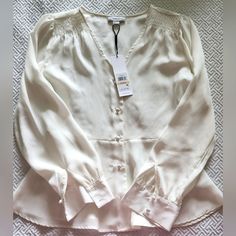 Beautiful Calvin Klein Silky Blouse With V Neck Style Button Down Ivory Color. Shoulder Detail. Fitted Workwear Tops With Pearl Buttons, Fitted Tops With Pearl Buttons For Work, Elegant V-neck Shirt For Brunch, Classic White Blouse With Pearl Buttons, White Formal Tops With Pearl Buttons, Elegant White Tops With Pearl Buttons, Formal White Tops With Pearl Buttons, Formal Spring Tops With Pearl Buttons, Formal Tops With Pearl Buttons For Spring