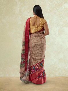 Step into elegance with our Brown and Red Printed Dola Silk Saree. This exquisite saree features a beautiful combination of brown and red hues on luxurious Dola Silk fabric, creating a stunning look for any occasion. The intricate print adds a touch of sophistication, making this saree a perfect choice for festivities. To care for this saree, we recommend dry cleaning to preserve the fabric's quality and vibrant colors, ensuring you can flaunt this saree with confidence for many gatherings to co Red Kalamkari Print Choli For Wedding, Festive Pre-draped Saree With Kalamkari Print, Bohemian Red Pre-draped Saree For Festive Occasions, Red Kalamkari Print Choli With Traditional Drape, Red Tussar Silk Traditional Wear With Kalamkari Print, Fitted Chanderi Saree With Kalamkari Print, Red Cotton Silk Pre-draped Saree For Puja, Festive Georgette Kalamkari Dupatta, Bollywood Style Festive Pre-draped Saree With Kalamkari Print