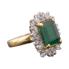 A stunning 6.57 carat Zambian Emerald and Diamond cocktail ring, set in 18K Yellow Gold and White Gold (Diamond part). The ring is currently sized at US 6.5, can be resized. Please feel free to message us if you have any queries. Free shipping provided. Returns accepted. Stone Details: Stone: Zambian Emerald Cut: Emerald Cut Weight: 6.57 Carat Diamond Details: Cut: Marquise, Round Total Carat Weight: 1.03 Carat Quality: VS/SI, G/H 18K Gold: 13.3 grams Chanel Ring, Deco Rings, Emerald Ring Vintage, Engagement Ring Art Deco, Diamond Cocktail Ring, Zambian Emerald, Diamond Cocktail Rings, Rings Engagement, Art Deco Engagement Ring