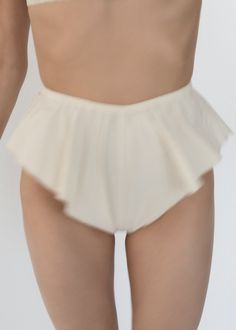 Parchment Poplin Flutter Shortie - High Cut Fluttery Sides with Baby Merrow Hems - Gathered Elasticized Waist Band - French Seams - Soft Crisp Japanese 100% BCI Cotton - BCI Cotton - https://bettercotton.org - Fitted - Made in USA Worn with Gathered Bralette White Cotton Bloomers With Ruffles, White Cotton Ruffled Bloomers, Stretch Bottoms With Ruffles In Solid Color, Cotton Ruffled Short Bloomers, Cotton Ruffled Bloomers, Fitted Cotton Shorts With Ruffles, Fitted Cream Bottoms With Ruffles, Fitted Cotton Bloomers With Ruffles, Stretch Cotton Ruffled Shorts