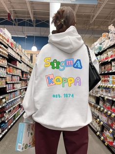 Soft, cute, and trendy, this Sigma Kappa hoodie will quickly become your go-to cozy sweatshirt! Use the drop down to specify preference between white, black, sand, dark chocolate, irish green, light blue, royal, light pink, or heliconia.  LISTING IS FOR SIGMA KAPPA. Please be sure you are ordering for your correct Sorority.  We print on high quality, soft, & heavyweight materials, sustainably made and printed in the US. ♥ SIZING ♥ Unisex Sizing- For a more feminine, fitted look we recommend getting your size. For a more oversized look, we recommend sizing up. ♥ SHIP TIME ♥ Items may take up to 7 business days to process before shipping. Shipping time is (on average) an ADDITIONAL 2-5 business days. Shipping times vary for many reasons, but is largely influenced by your location. ♥ CARE INS Doodle Scrapbook, Big Little Sorority, Alpha Epsilon Phi, Theta Phi Alpha, Kappa Alpha Theta, Alpha Sigma Alpha, Alpha Chi Omega, Gamma Phi, Sigma Kappa