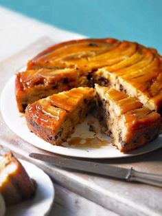 a cake on a plate with one slice cut out