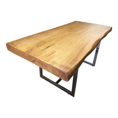 a wooden table with metal legs on a white background