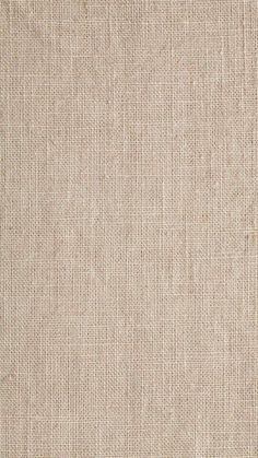 a close up view of a beige fabric texture