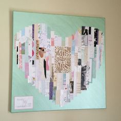 a piece of art made out of different types of scraps and papers on a wall