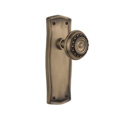 an antique style door handle on a white background