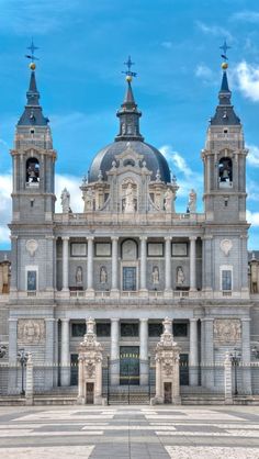 a large building with two towers and clocks on it