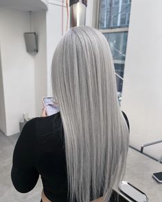 Silver Hair Color Is Blowing Up Again And Here's How To Wear It Pale Silver Hair, Icy Silver Hair Dark Roots, Grey Silver Hair Color, Light Gray Hair Color, Icy Grey Hair, Platinum Gray Hair Silver, Silver Blonde Hair Balayage, Icy Grey Blonde Hair, Icy Silver Hair