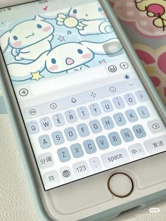 an iphone with hello kitty stickers on the screen